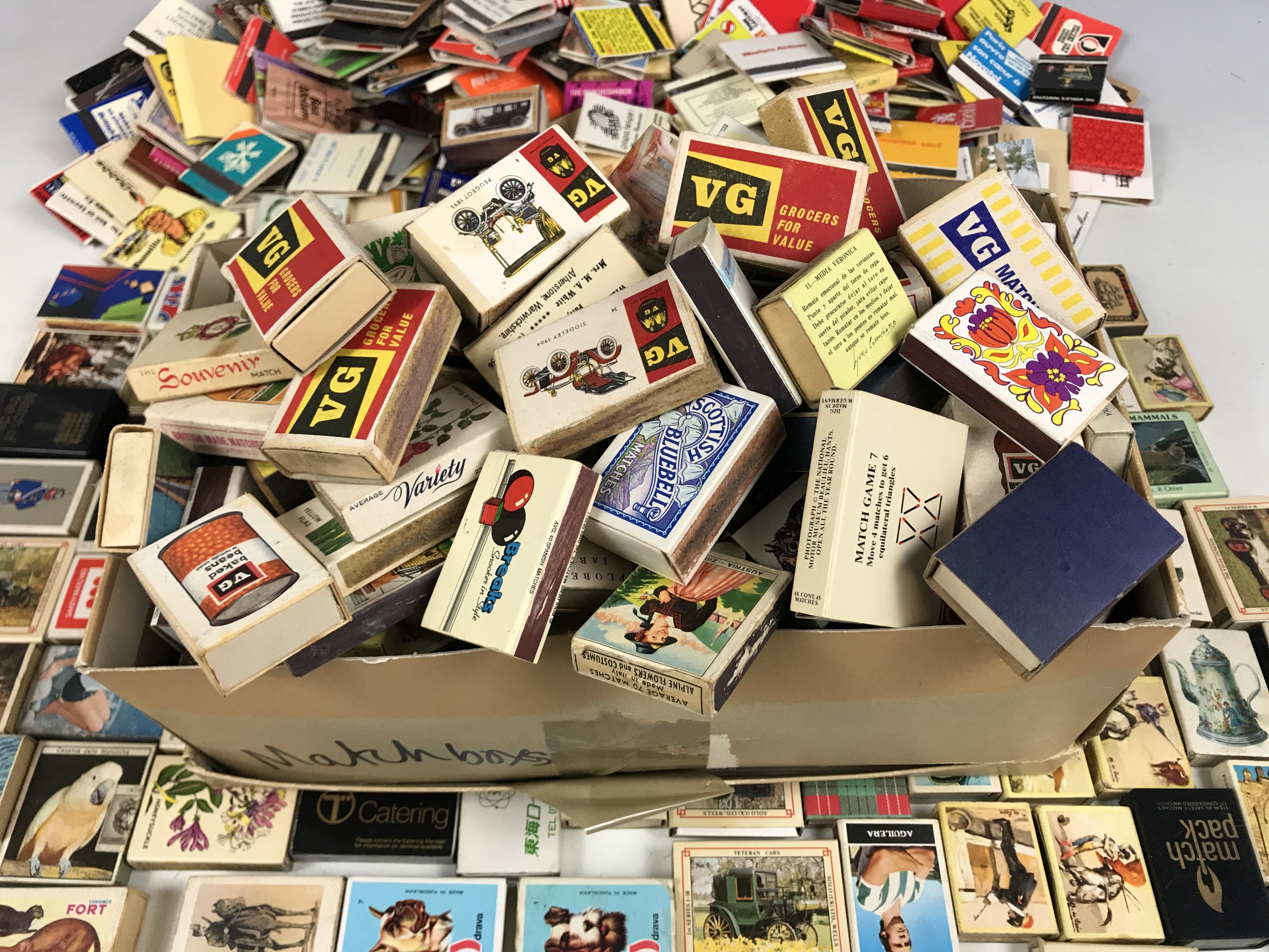 A large collection of match boxes and match books