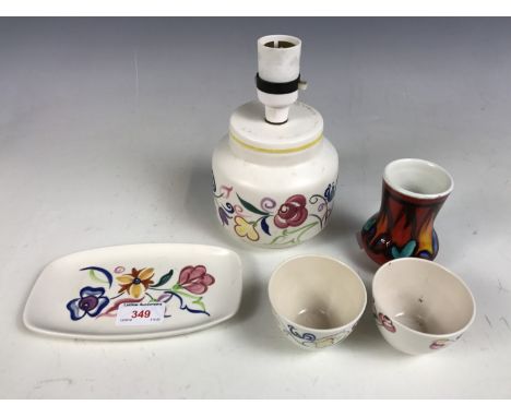 Items of Poole Pottery, including a lamp base and a Delphis range vase etc.