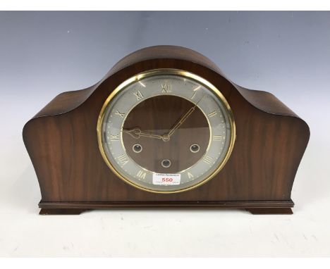 A 1950's walnut mantel clock