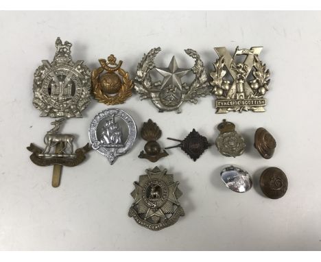 A small quantity of British army cap badges etc including Royal Marine Light Infantry, cast Tyneside Scottish etc