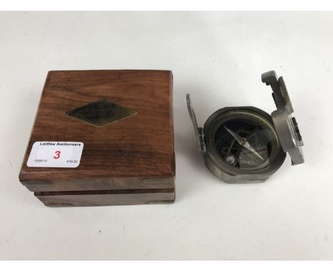 A reproduction cased compass