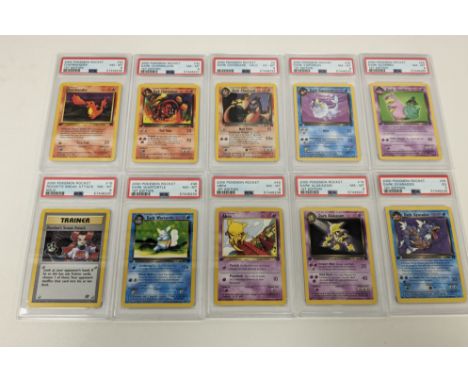 This lot features 60 cards from the Team Rocket expansion, the highlight includes a holo PSA 6 Dark Charizard alongside multi