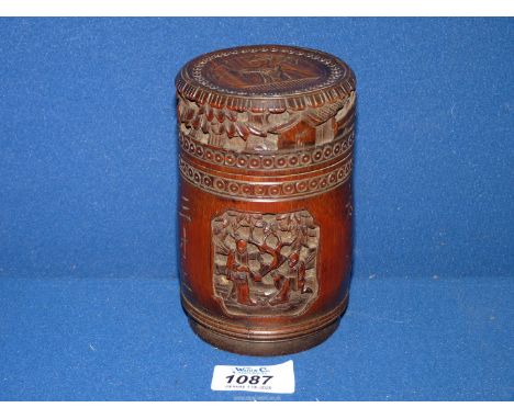 A Chinese bamboo cylindrical Tea Caddy/Tobacco box having carved reserves of figures and cranes, 5" tall x 3 1/4" diameter. 