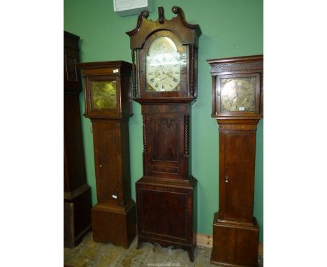 A most imposing Mahogany cased Longcase Clock having a triple arch design door flanked by mirrored twist pillars, the hood wi