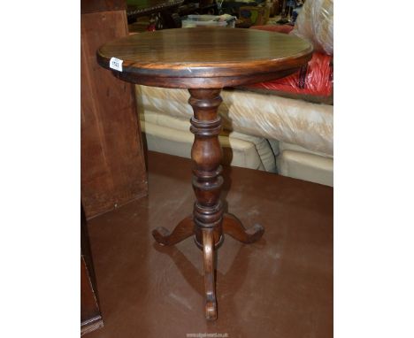 A Satinwood circular occasional Table standing on a turned pillar with three splay feet, 29 3/8" high x 19 3/4"'' diameter.