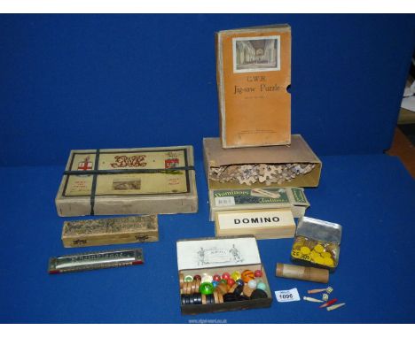 A small quantity of games and puzzles including; a boxed Chad Valley G.W.R wooden jigsaw, marbles, two miniature bone dice pl