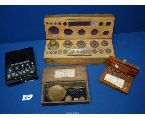 A quantity of cased weights and scales.