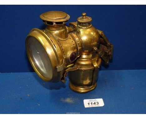 A brass Lucas Model 262 KIng of The Road carbide bicycle lamp.