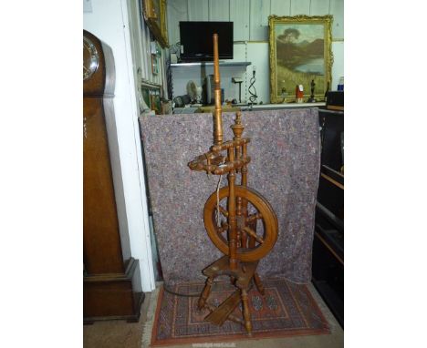 A compact design Spinning Wheel, 15 1/2" deep x 12 1/2" wide x 49 3/4" high approx.