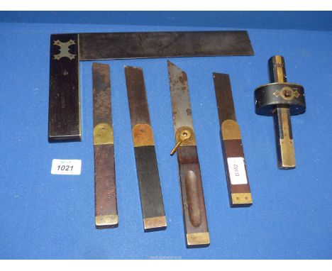 A late 19th century brass and ebony carpenter's set Square, stamped Forsyth, also a slide rule and a mortice gauge plus three