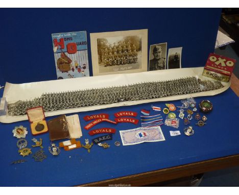 A quantity of Military cap badges to include: WWII British Army Loyal Regiment (North Lancashire), South Wales Borders, The R