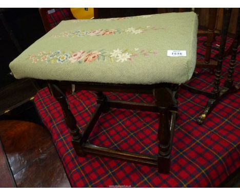 A contemporary dark Oak joynt Stool, the turned legs with perimeter stretchers, and having a tapestry cushion with floral dec