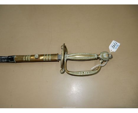 **COLLECTION ONLY**  A dress Sword having a slim etched/engraved blade, 30 3/4" long, the square brass grip having beaded edg