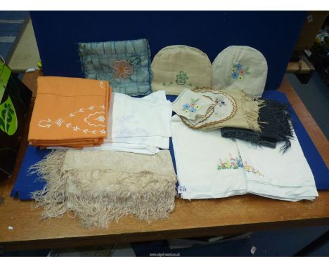 A quantity of embroidered linen including; pretty floral tablecloths, pillowcases, large piece of Hessian, silk scarf, etc.
