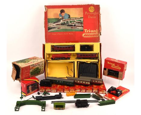 A selection of Tri-ang toys, mostly trains. To include A Triang RO Passenger Train boxed set - lacking some parts, damaged bo