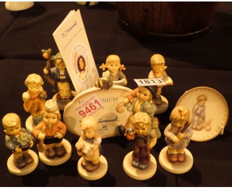 Ten Goebel Collectors Club figurines a small plate and an advertising stand
