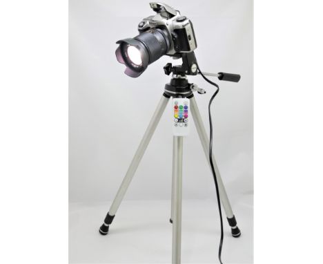 Camera lamp in the form of a Nikon SLR with colour chaging LED and remote control on a tripod  CONDITION REPORT: All electric