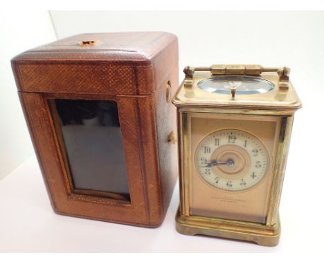 Cased brass repeater carriage clock with key retailed by Piddock and Sons Southport  CONDITION REPORT: One side of the glass 