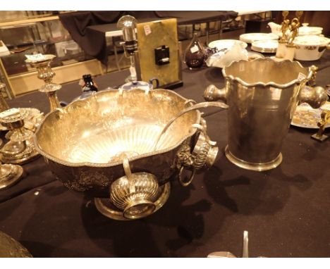 Large Victorian EPNS embossed punch bowl with lion mask handles six matching cups and ladle and an early 20thC silver plated 