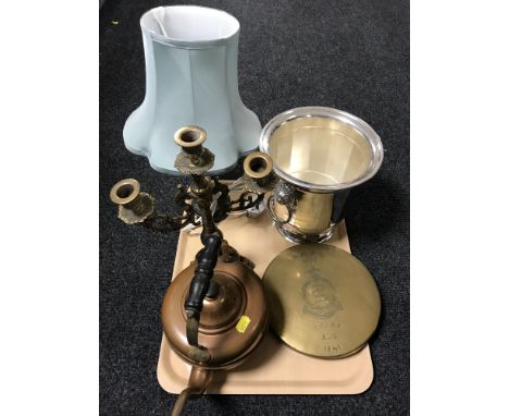 A tray of plated table lamp base with shade, plated ice bucket with lion mask handles, military dinner gong, copper kettle an