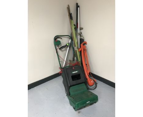 A Qualcast electric lawn raker with box, Flymo strimmer, garden tools, drain rods etc 