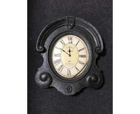 A black framed shaped cafe wall clock 