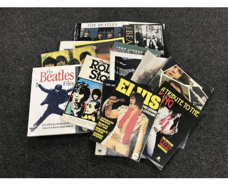 A crate containing books relating to the Beatles, Rolling Stones and Elvis