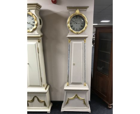 A painted long cased clock with enamelled dial by Andreas Holm dated 1858 