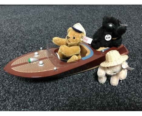 A Steiff Cris Craft motorboat set with additional black Steiff bear