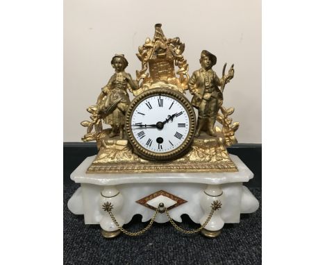 An antique French gilt mantel clock on marble plinth with enamelled dial 
