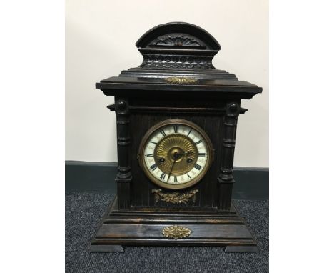A pine cased German 14 day striking clock with enamelled dial 