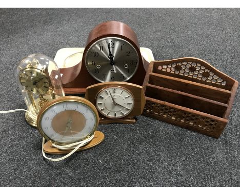 A tray of mid twentieth century mantel clocks, anniversary clock under shade, wooden correspondence rack 