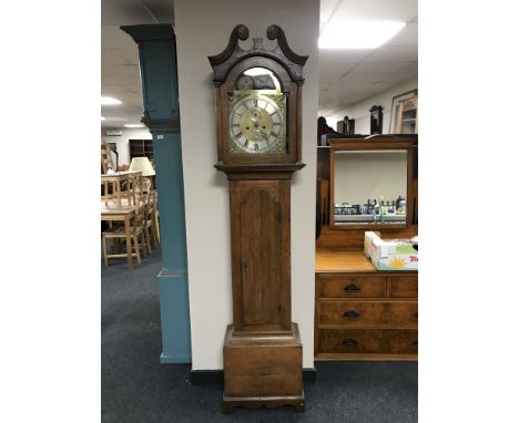 An oak longcase clock with brass and silvered moonphase dial signed John Turnbull of Hawick, later movement