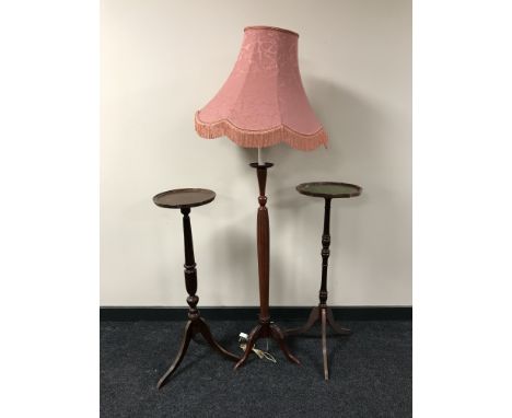A mahogany effect torchere and a standard lamp with shade 
