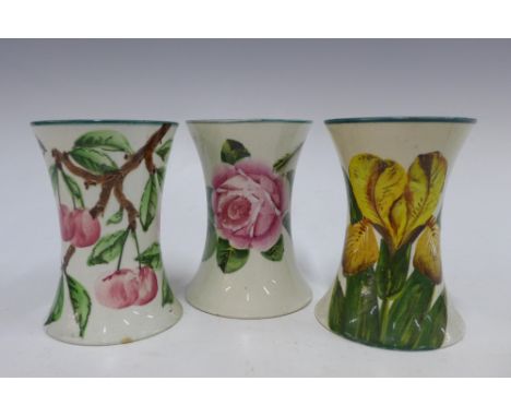 Wemyss trio of small waisted vases, handpainted patterns include daffodil, cabbage rose, and cherry , 11cm (3) 