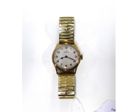 OMEGA, a gents vintage gold cased wristwatch with silvered dial and Arabic numerals 
