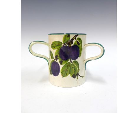 Wemyss Ware plums pattern tyg, one handle restored, 14.5cm 