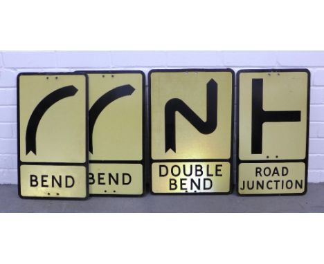 Four vintage reflective road signs, including a Winsser 'road junction', 'double bend' and two right hand 'bend' signs, large