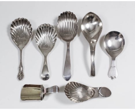 A George V silver caddy spoon with plain bowl and plain trefoil pattern handle by T.B. & S., Sheffield 1923, five other silve