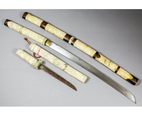 A Japanese Wakizashi in carved bone scabbard, with 18.5ins (470mm) blade, 33ins (838mm) overall, and similar Tanto with 7.5in