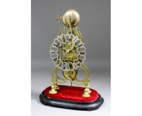 A 19th Century brass framed "Skeleton" timepiece, the 6ins diameter silvered chapter ring shaped and fretted and decorated wi