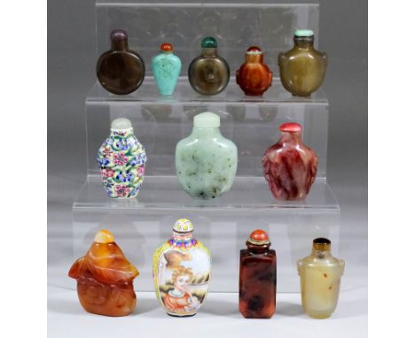 A collection of Chinese jade, hardstone, enamel and porcelain snuff bottles and covers, including - spinach jade of plain for