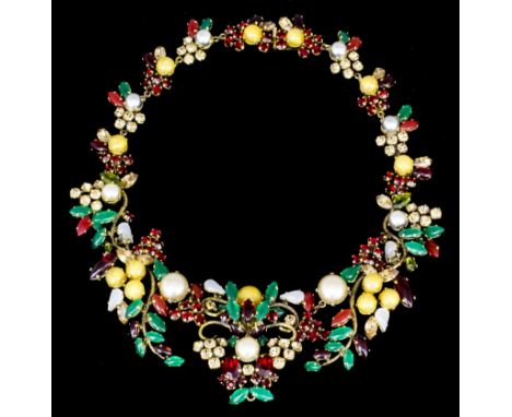 A 1962 Christian Dior gilt metal and rhinestone set collar necklace, the face set with red, green, amber, opaque white and fa
