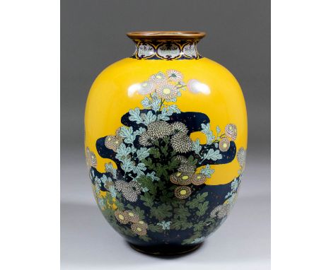 A Japanese cloisonne enamel bulbous vase decorated with chrysanthemums on a sand coloured and dark blue ground, 9.75ins (248m