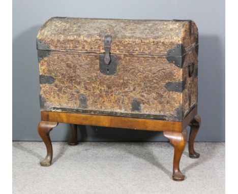 A 19th Century Continental wicker and cast iron mounted domed top travelling trunk, on later associated mahogany stand, 33ins