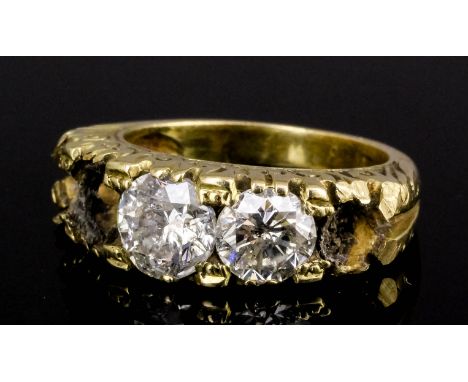 A gold coloured metal mounted diamond set ring (mount originally for five stones but now only bears two), one brilliant cut s