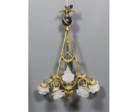 A late 19th/early 20th Century Contintental gilt metal six light pendant electrolier with later frosted glass shades, circula