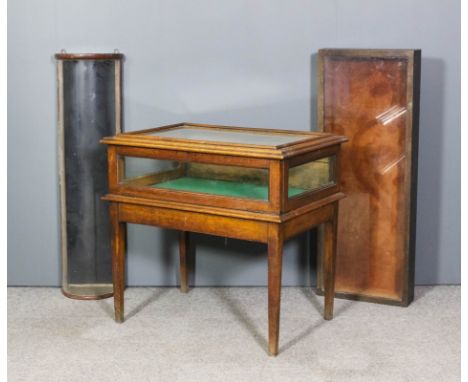 An oak rectangular display table on square tapered legs, 32ins x 22ins deep x 21ins high, a brown painted wood bow-front tabl