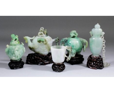 A Chinese jade teapot and cover carved with bird pattern spout and naturalistic handle, the body with archaic emblems, 4.25in