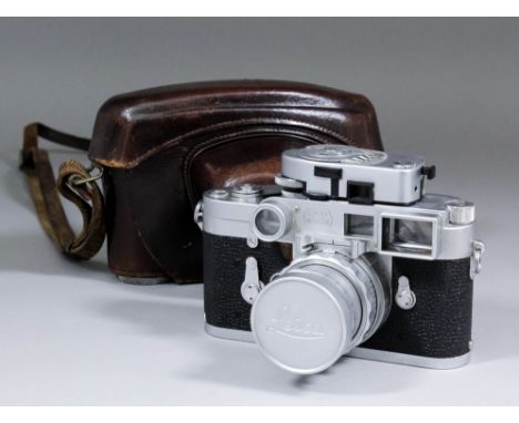 A Leica M3 Rangefinder camera, body No. 928507, with spectacles and light meter, and Summicron, 50mm lens (No. 1581086), with